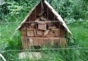 A hedgehog house made of wood by pupils from Sonning Common Primary School