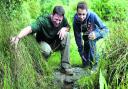 Billy Clarke, of Oakley, near Thame, is given the lowdown on wildlife ponds from BBOWT president Steve Backshall                                    Picture: Ric Mellis/BBOWT