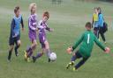 Botley’s Finley Ludlow sees this effort saved by Cumnor keeper Ethan Richie, but went on to score a hat-trick in the Under 12 League clash