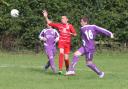 Botley's Harley Bruton emphatically clears the ball up field during their under 13 clash with Faringdon