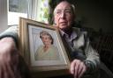 Lonely and vulnerable: Colin Packer, 84, with a picture of his late wife Doris
