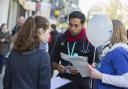 Call for support: Junior doctor Karthick Darma speaks to shoppers about planned industrial action and reasons for striking in Oxford last month