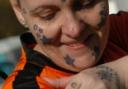 Sharon Brown shows off her Children's Hospital tattoo