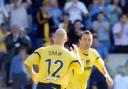 Jeannin celebrates his goal with Paul Shaw