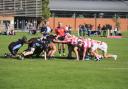 Abingdon School (right) take part in a rugby scrum