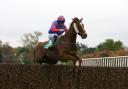 Step Back and Jamie Moore on their way to winning the bet 365 Gold Cup at Sandown
Picture: Julian Herbert/PA