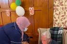 Bert Rowan with a cake on his 90th birthday Pictures: Barchester Healthcare