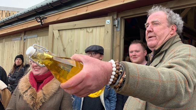 Jeremy Clarkson raffles water at Diddly Squat Farm Shop