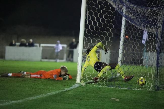 Gatlin O'Donkor slides in to score for Oxford United Under 18s Picture: OUFC