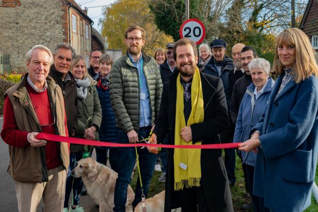 Cllr Tim Bearder cuts the ribbon to unveil the new 20mph limit in Cuxham