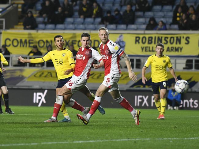 Nathan Holland sweeps home Oxford United's third goal Picture: David Fleming