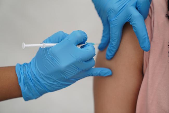 A person receving the Covid vaccine. Credit:PA