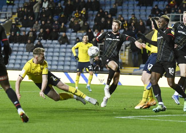 Sam Long attempts a diving header in Oxford United’s draw with Rotherham United Picture: David Fleming