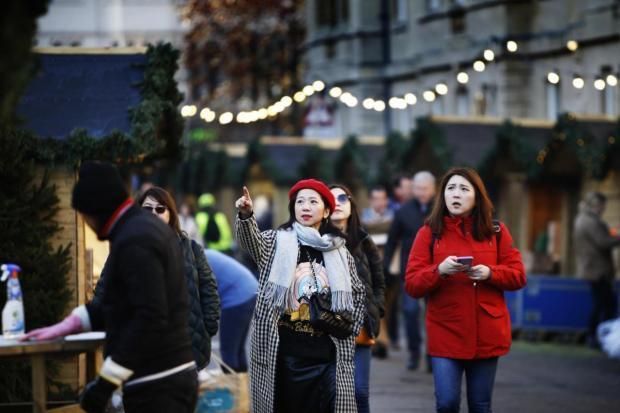 Shoppers enjoy a walk through Oxford Christmas Market. Picture: Ed Nix