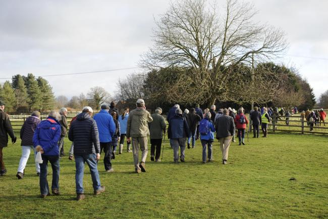 More than 250 people 'protest walk' against warehouse plan on green belt
