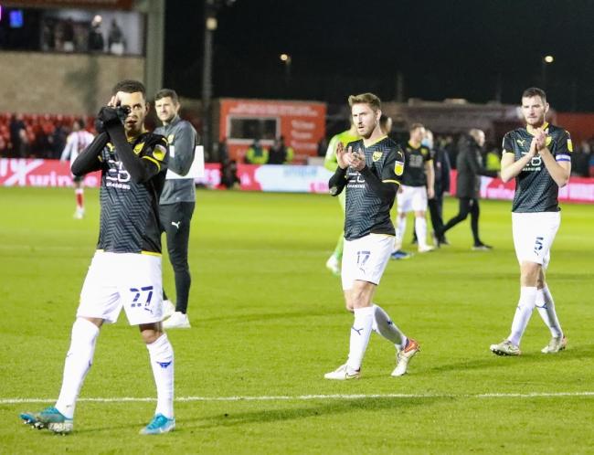 Oxford United applaud their fans after the 2-0 defeat at Lincoln City Picture: Steve Edmunds