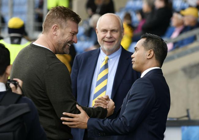 Oxford United head coach Karl Robinson with directors Horst Geicke (centre) and Anindya Bakrie Picture: David Fleming