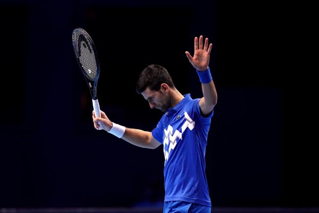 Novak Djokovic gestures on court