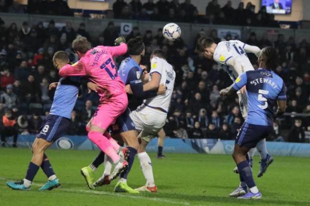 Jordan Thorniley challenges for a header against Wycombe Wanderers. Picture: Darrell Fisher