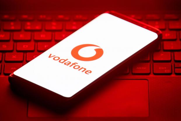 Oxford Mail: Vodafone logo on a phone placed on a keyboard. Credit: PA
