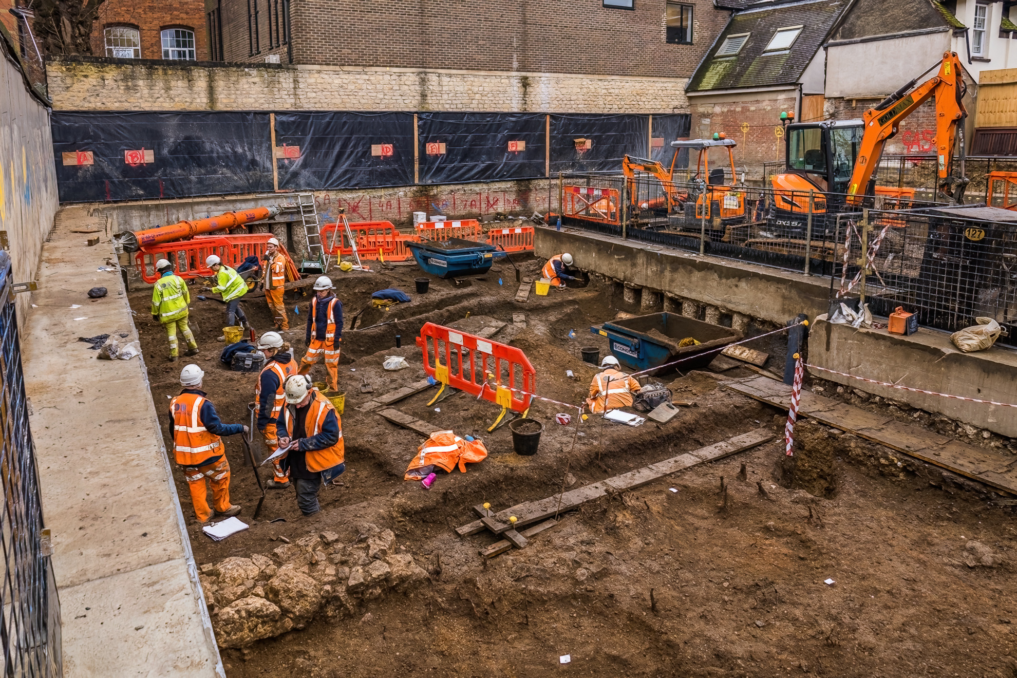 The archaeological team from Oxford Archaeology excavating pits on site in the east wing of the new basement Picture: SIMON GANNON