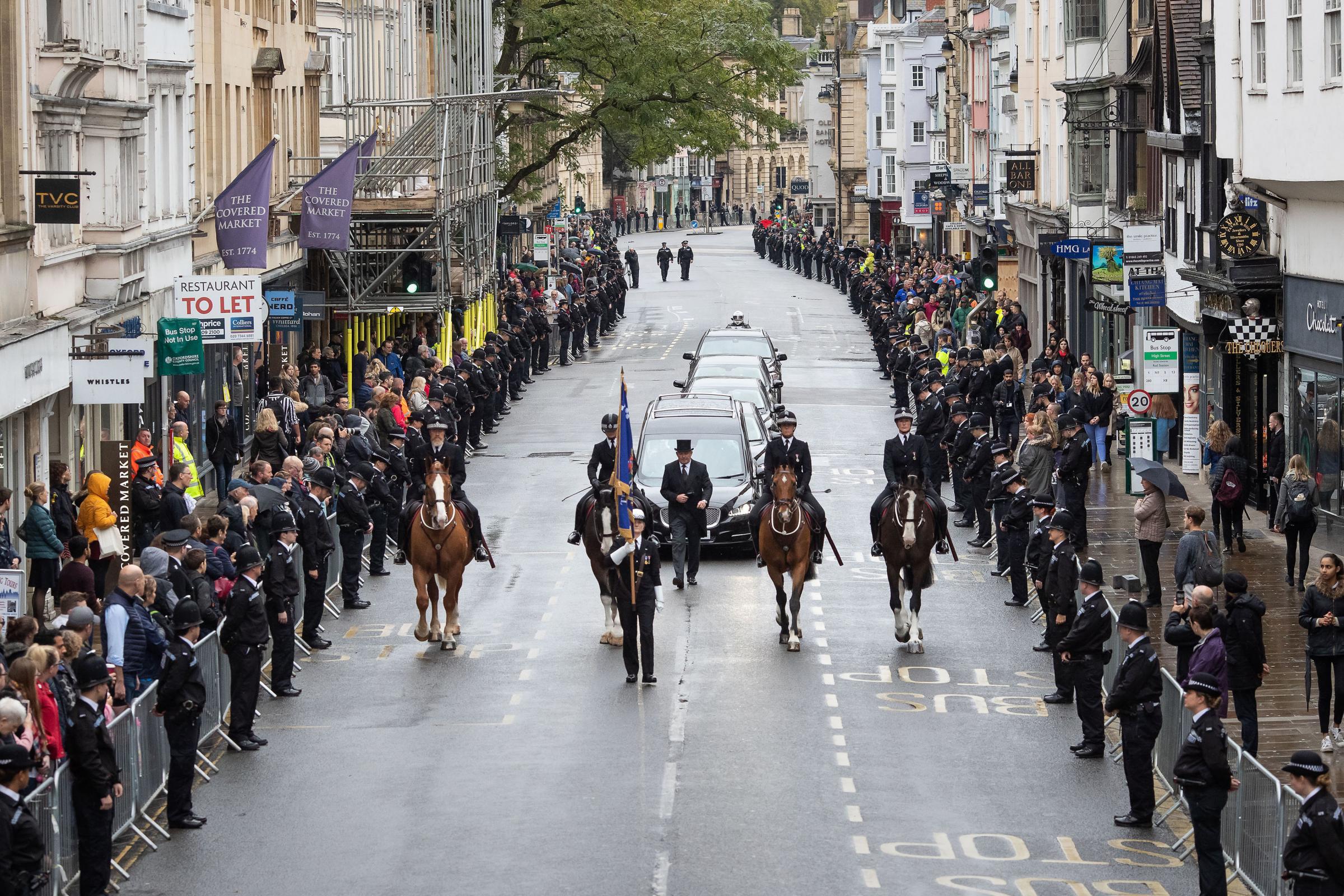Police flank the High Street in Oxford ahead of Andrew Harpers funeral at Christ Church Cathedral Picture: PA WIRE