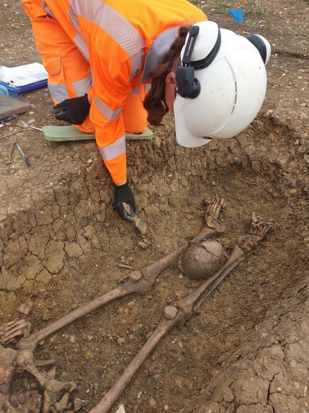 Oxford Mail: Oxford archaeologists have discovered approximately 40 decapitated skeletons in a large Roman cemetery. Picture: HS2/PA