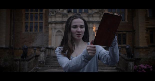 Oxford Mail: Anna burning the haunted diary