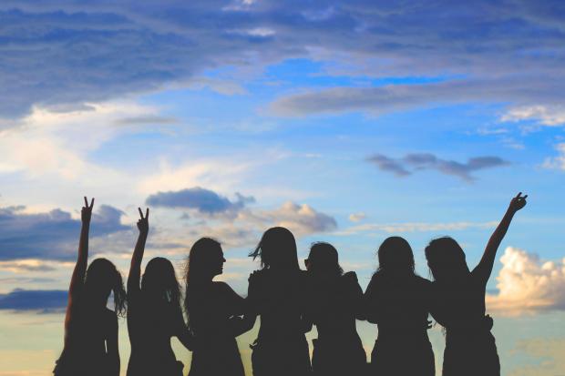 Oxford Mail: Shadows of women celebrating looking at the sky. Credit: Canva