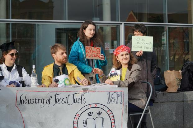 Oxford Mail: 'No to business as usual' and 'No to links with fossil fuels'. Students protest outside Said Business School.