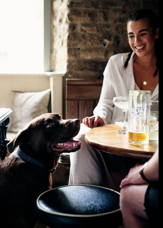 Oxford Mail: A woman and a dog at The Horseshoes. Credit: Tripadvisor