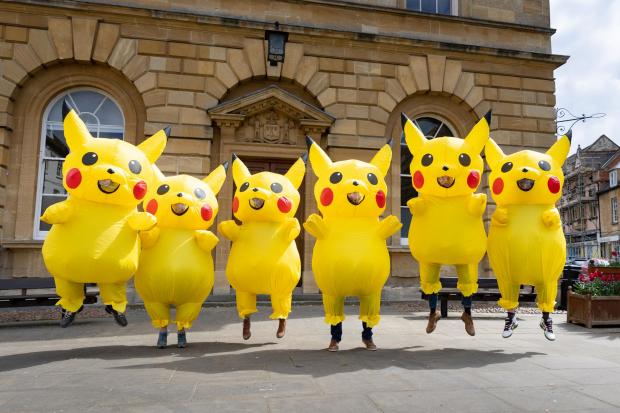 Oxford Mail: Protestors in Woodstock dressed as the popular Pokemon character Pikachu, to call for a 20mph speed limit in the town. Picture: Cyrus Mower