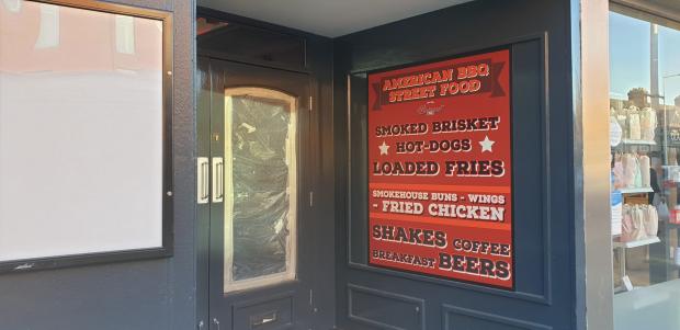 Oxford Mail: A sign placed in the door way is advertising their BBQ options