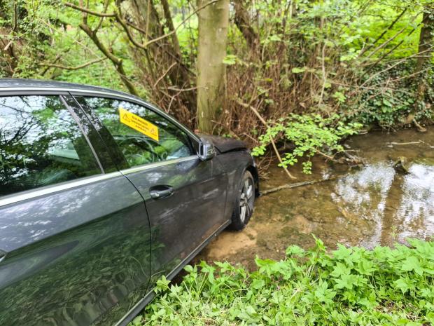 Oxford Mail: Firefighters attended a car which ended up in a river, in Swerford. Picture: Oxfordshire Fire and Rescue Service