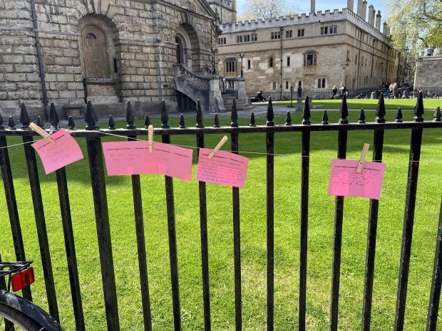 Oxford Mail: Pink postcards put up at the Radcliffe Camera with stories of sexual abuse victims being silenced.