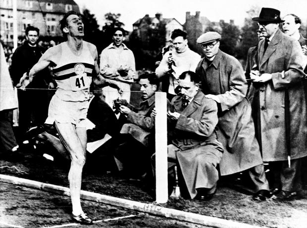 Oxford Mail: EMBARGOED TO THURSDAY 0001 JULY 22 File photo dated 6/5/1954 of Roger Bannister finishing the race during an athletics meeting at Oxford where he ran the world's first four minute mile. Sir Roger Bannister is to be honoured with a memorial at