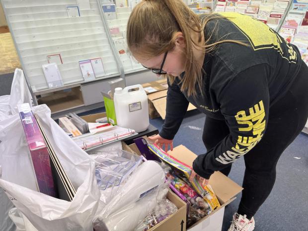 Oxford Mail: April Smart, age 26, packs up the left over products from Pen to Paper as it prepares to close down.