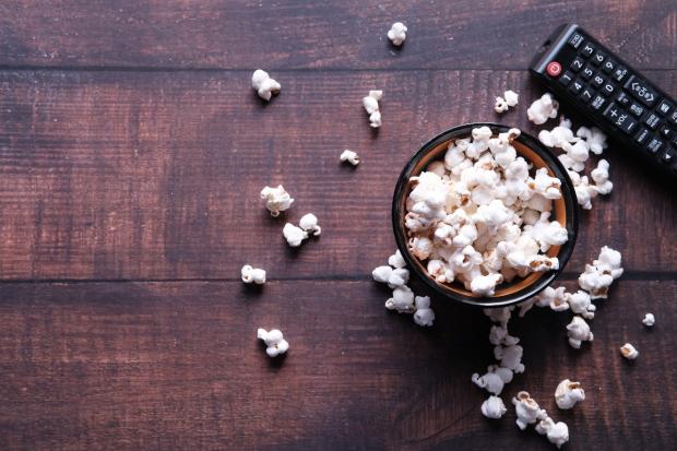 Oxford Mail: A bowl of popcorn and a TV remote (Canva)