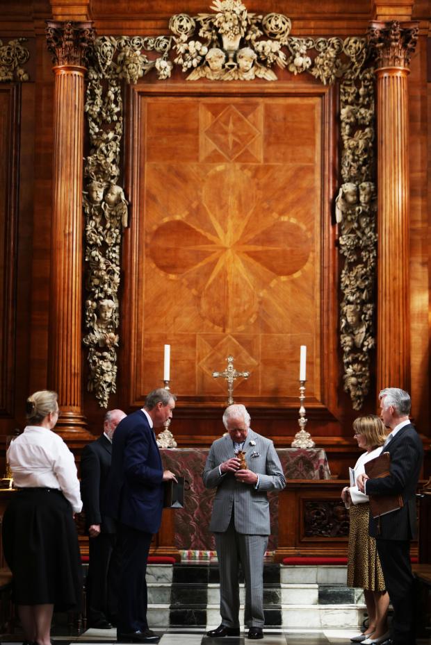 Oxford Mail: Prince Charles was shown the restored Grinling Gibbons Carvings at the College Chapel.