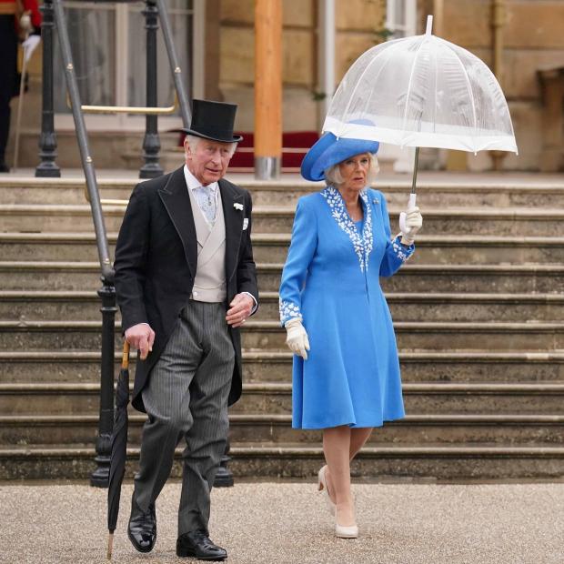 Oxford Mail: The Prince of Wales and the Duchess of Cornwall during a Royal Garden Party at Buckingham Palace. Picture: PA