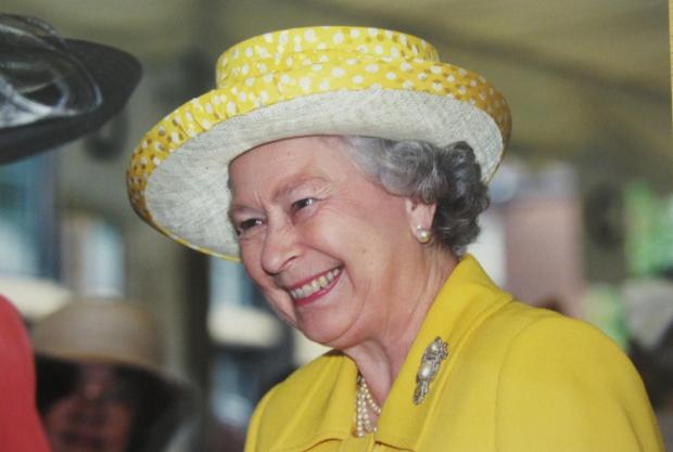 Oxford Mail: An image captures the Queen smiling radiantly whilst visiting University College in 1999. Photo from University College. Photo from University College. 