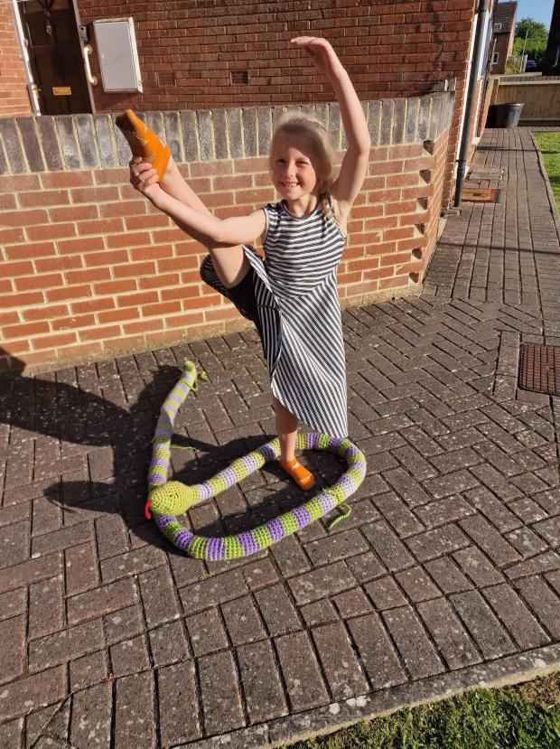 Oxford Mail: Alexys showing off her dance moves with the snake. Picture: Samantha Redford