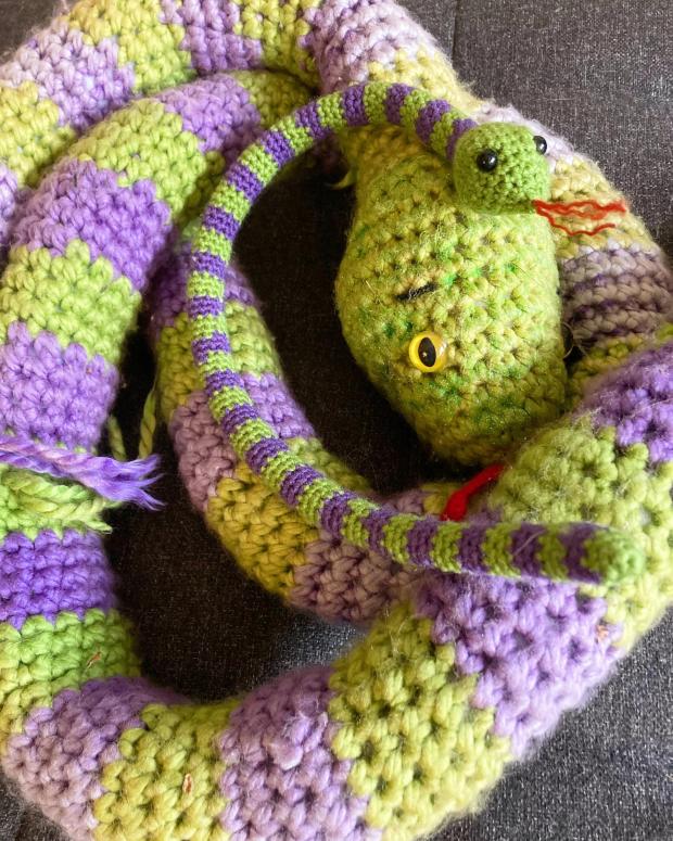 Oxford Mail: The original snake and the mini one created for Alexys. Picture: Crochet Kindness by R