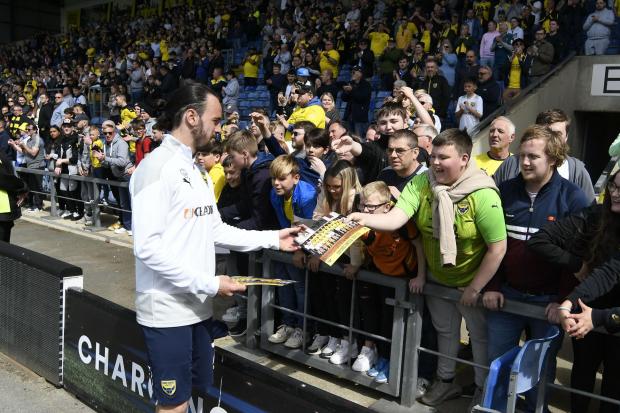 Ryan Williams signs autographs after the last game of the season - his final match for Oxford United Picture: David Fleming
