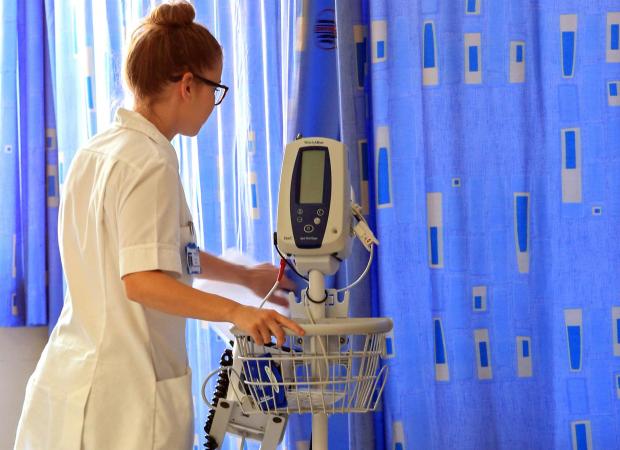 Oxford Mail: File image of a nurse working in a ward. Picture: PA Media 