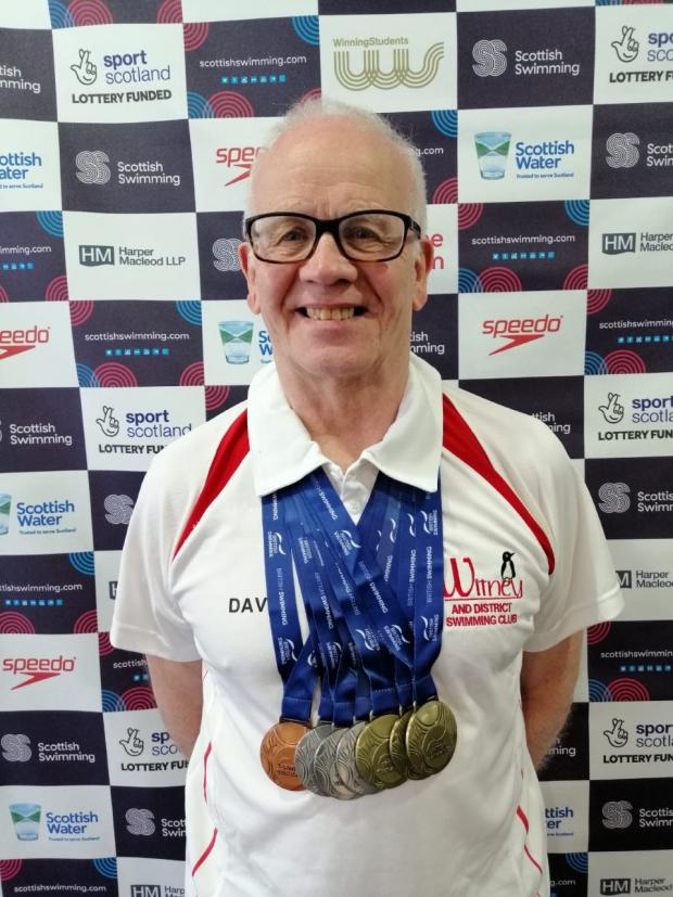 Oxford Mail: David Hall of Witney and District Swimming Club, with his medal haul