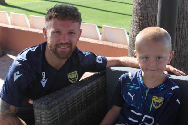 Oxford United fan Gianni, five, met striker Matty Taylor at an open training session in Marbella Picture: OUFC