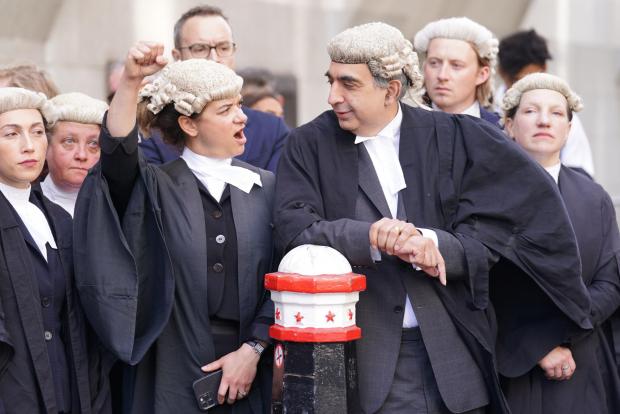 Oxford Mail: Barristers outside the Old Bailey on Monday morning Picture: PA WIRE