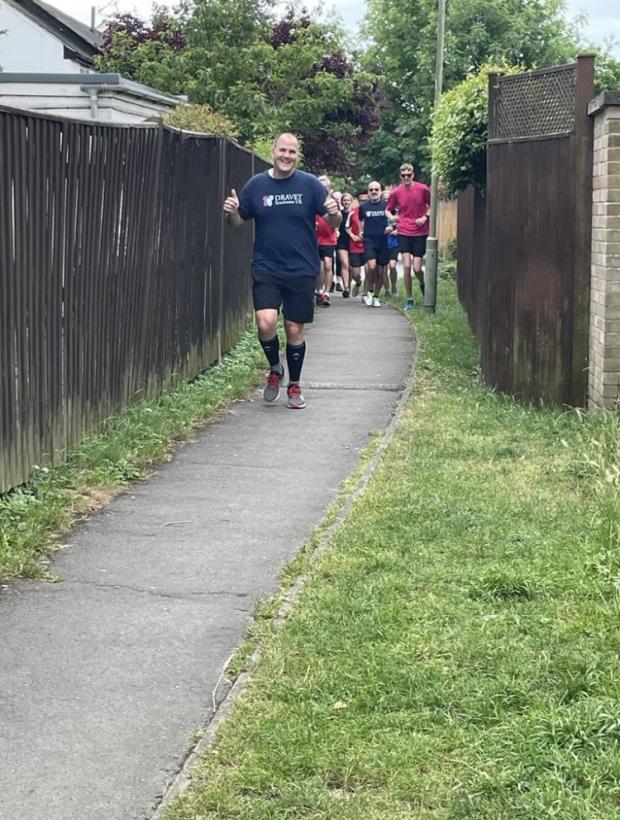 Oxford Mail: Brett running with the group behind him