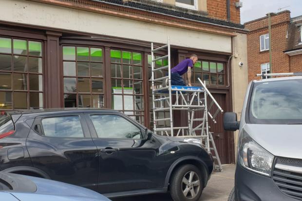 Oxford Mail: Workers removed the Lloyds signage yesterday (July 22)